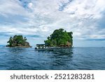 Stunning Tropical Scenery of Isla de los Pájaros in Bocas del Toro, Panama Featuring Lush Vegetation, Wildlife, and Dramatic Coastal Rock Formations in the Caribbean Sea