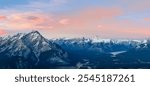 Stunning twilight panoramic view of Bow Valley and town of Banff surrounded by Canadian Rocky mountains in at Banff National Park in Alberta, Canada. View from Banff Gondola Sulphur Moutain