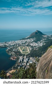 Stunning vertical aerial view of Rio de Janeiro, Brazil with Leblon neighborhood and Formula One track seen from Christ the Redeemer