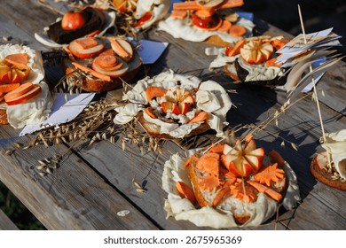 A stunning and vibrant array of artistic vegetable decorations artfully arranged on a lovely wooden table