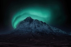 Stunning Vibrant Northern Lights Aurora Composite Image Over Landscape Of Snowcapped Mountain In Scottish Highlands