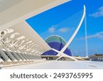 Stunning view of architectural symmetry featuring futuristic structures and colorful design elements within the City of Arts and Sciences complex in Valencia, Spain