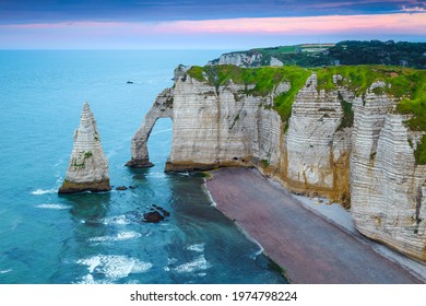 Stunning view with Atlantic Ocean and tidal shoreline at sunrise, Etretat, Normandy, France, Europe