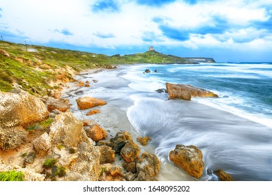 Stunning  view of  Capo San Marco Lighthouse on Del Sinis peninsula.  Long exposure. Location:  Cabras, province Oristano, Sardinia, Italy, Europe - Powered by Shutterstock