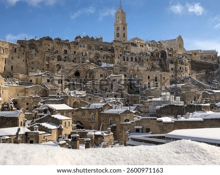 A stunning view captures the ancient cave dwellings of Matera, Italy, during a rare snowfall. 