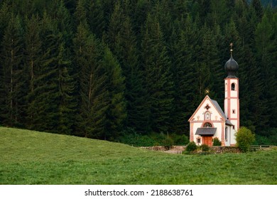 Stunning view of the Church of St. John (San Giovanni in Ranui ) that stands out in the green meadows, in the heart of the beautiful Dolomitic mountain landscape