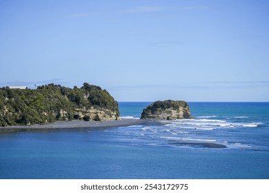 A stunning view of a coastal landscape featuring clear blue water, rocky formations, and gentle waves under a bright sky, perfect for nature lovers and travel enthusiasts. - Powered by Shutterstock