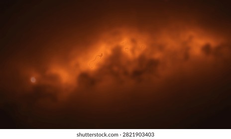 A stunning view of a distant nebula in deep space, illuminated by intense orange and yellow light, showcasing the beauty of the universe.