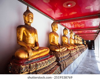 A stunning view of golden Buddha statues lined in a tranquil temple interior, showcasing rich cultural heritage and intricate design. Perfect for travel and spirituality themes. - Powered by Shutterstock