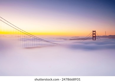 A stunning view of the Golden Gate Bridge rising above the fog in San Francisco, California, USA - Powered by Shutterstock