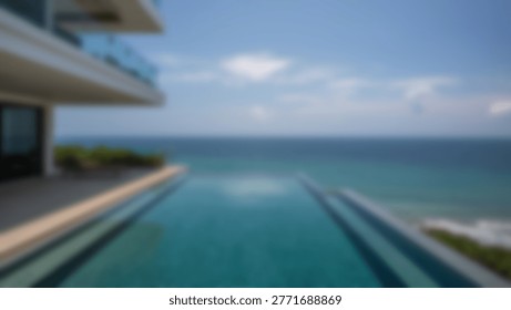 Stunning view of an infinity pool with a beautiful ocean backdrop on a bright, sunny day. The water reflects the skys blue hues.