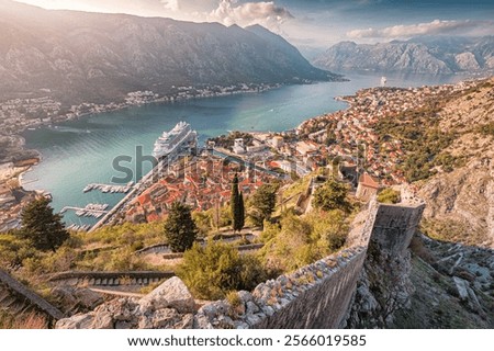 A stunning view of Kotor, Montenegro, with its historic fortress walls, Adriatic Sea, and charming old town nestled by the bay.