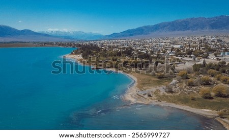 Stunning view of Lake Issyk Kul and city landscape in Kyrgyzstan during clear weather
