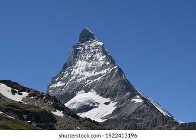 Stunning view of the magnificent Matterhorn mountain, Valais, Switzerland. Swiss Alps landscape in Summer. Space for copy. 