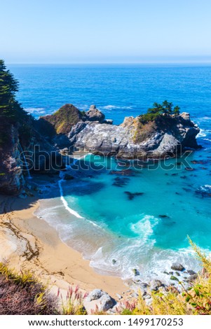 Stunning view of McWay falls on the coast of Big Sur in central California that flows year-round into the Pacific Ocean