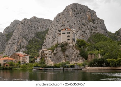 Stunning view of the mountains surrounding the city of Omis, Croatia, with a beautiful landscape blending rocky peaks and lush greenery. - Powered by Shutterstock