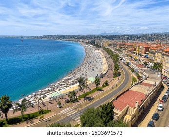 A stunning view of Nice, France showcasing the vibrant beachfront, azure sea, and bustling promenade. The scenic coastal cityscape reflects a lively summer atmosphere. - Powered by Shutterstock