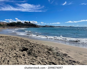 Stunning View Of Sandy Beach And Atlantic Ocean Landscape On A Sunny Day In Playa Del Duque On Tenerife Island, Spain