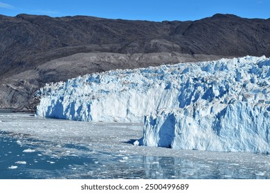 Stunning view from the side on the frontside and the moraine of the Eqip Sermia glacier, one of the most active glaciers of the world