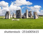 Stunning view of Stonehenge under a bright sky. This iconic prehistoric monument in England features towering stone structures in a lush green field, perfect for travel and history-themed collections.