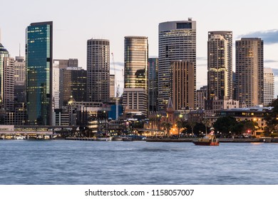 Stunning View Of The Sunset Over The Sydney Financial District Skyline And The Circular Quay Harbor In The Sydney Bay In Australia Largest City