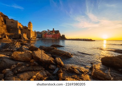 Stunning view of Vernazza village in Cinque Terre National Park, beautiful cityscape with colorful houses, sea and a harbor at sunset, Liguria region of Italy. Outdoor travel background