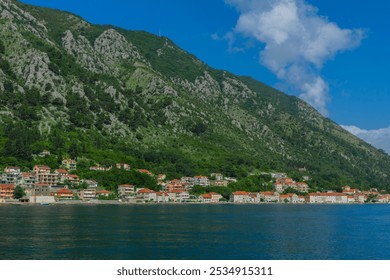 Stunning views of Kotor, Montenegro's historic coastal town, featuring medieval architecture, picturesque seashore, and majestic mountains. Perfect for travel, tourism, and nature photography. - Powered by Shutterstock