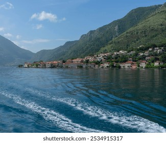 Stunning views of Kotor, Montenegro's historic coastal town, featuring medieval architecture, picturesque seashore, and majestic mountains. Perfect for travel, tourism, and nature photography. - Powered by Shutterstock