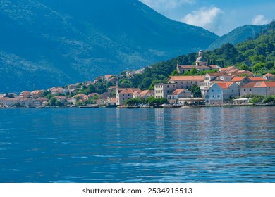 Stunning views of Kotor, Montenegro's historic coastal town, featuring medieval architecture, picturesque seashore, and majestic mountains. Perfect for travel, tourism, and nature photography. - Powered by Shutterstock