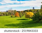 Stunning views of the verdant gardens, contrasting with the yellows and red of the change of seasons to Fall seen here at the scenic Dominion Arboretum,Ottawa,Ontario,Canada