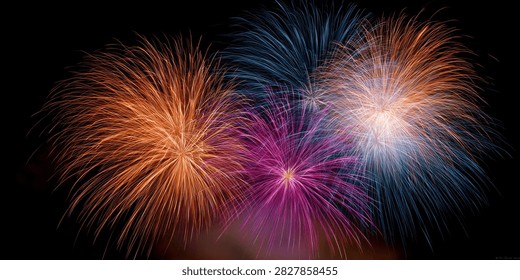 A stunning visual of multiple fireworks exploding in the dark night sky, creating a dazzling spectacle of light and color.