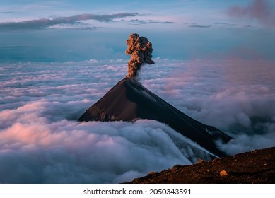 The stunning Volcan de Fuego in Guatemala erupting at sunrise seen from Acatenango Summit - Shutterstock ID 2050343591