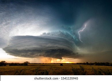 A stunning "wedding cake" supercell seen near Severy, Kansas, caught with lightning to the side.