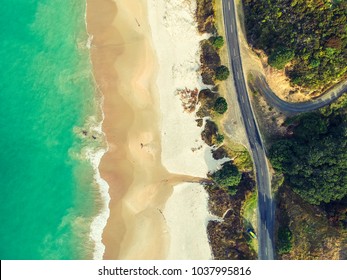 Stunning Wide Angle Aerial Drone View Of Otama Beach And Black Jack Road Near Matarangi On The Coromandel Peninsula In New Zealand. Beautiful Pattern / Texture Of Ocean, Beach, Trees And The Road.