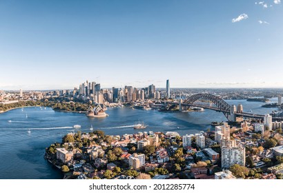 Stunning Wide Angle Panoramic Aerial Drone View Of The City Of Sydney, Australia Skyline With Harbour Bridge And Kirribilli Suburb In Foreground. Photo Shot In May 2021, Showing Newest Skyscrapers.