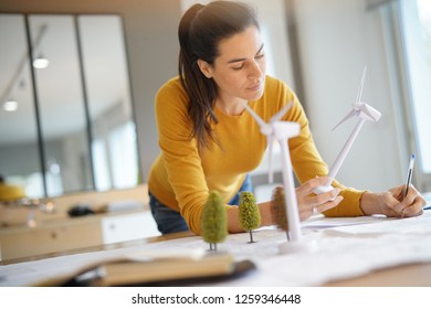 Stunning Wind Turbine Engineer With Cellphone Planning Wind Farm Placement