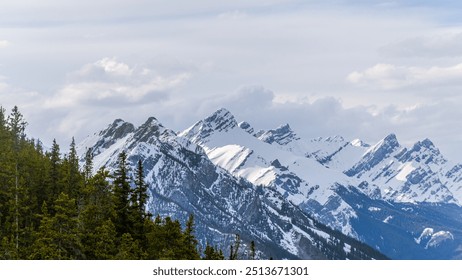 A stunning winter view from the top of the Banff Gondola, showcasing snow-covered mountains and breathtaking landscapes in every direction. - Powered by Shutterstock