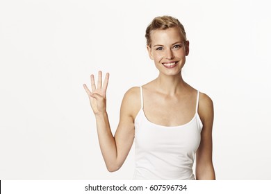 Stunning Woman Holding Up Four Fingers, Portrait