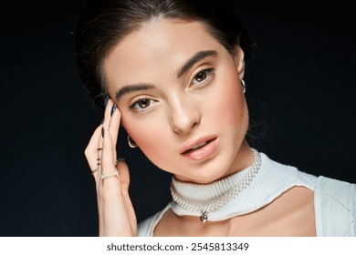 A stunning woman showcases her grace while thoughtfully resting her hand on her head. - Powered by Shutterstock