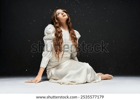 Similar – Image, Stock Photo Young woman gazing upwards in urban setting