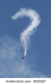 A Stunt Airplane Performs A Dive And Appears To Draw A Question Mark In The Sky With Smoke