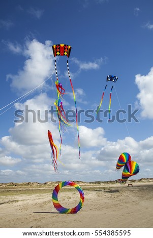 Similar – a colorful garland blows in the wind on the north sea