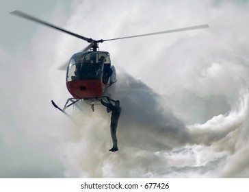 Stunt Man Hanging On Helicopter