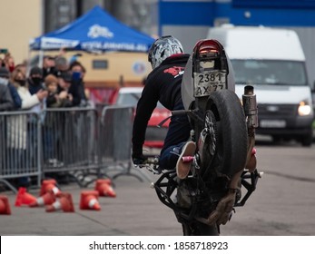 Stunt Performer Shows Stunts On A Sports Motorcycle