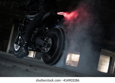 Stunt Rider Ride And Burn Wheel Tire With Engine Power