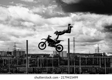 Stuntman On A Bike Performing A Stunt Jump In The Air