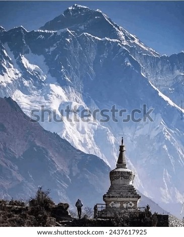 Stupa at Namche Bazar and Mount Lhotse's south rock face on the road to Everest base camp, Nepal.