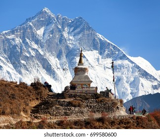 Stupa near Namche Bazar and Mount Lhotse south rock face - way to Everest base camp - Nepal