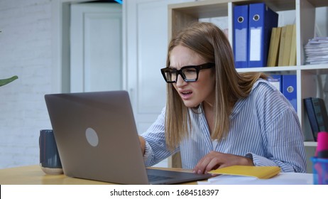 Stupid-looking fun girl playing office woman typing on laptop keyboard using technology for first time working in the company.