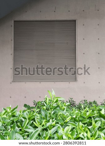 A sturdy metal roller shutter or rolling security door designed for commercial and industrial premises, featuring interlocking horizontal slats, a durable steel or aluminium construction, and a smooth rolling mechanism for secure closure. Ideal for shopfronts, warehouses, garages, and storage facilities.